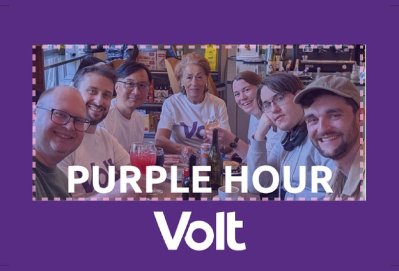 A graphic with a purple background and the white Volt logo, framing a photo of people at a cafe with the text 