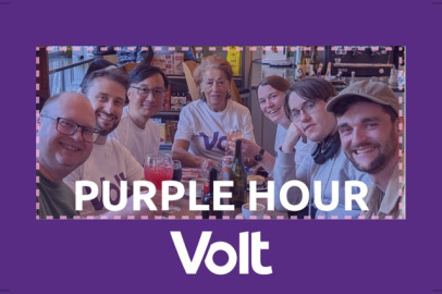 A graphic with a purple background and the white Volt logo, framing a photo of people at a cafe with the text "PURPLE HOUR."