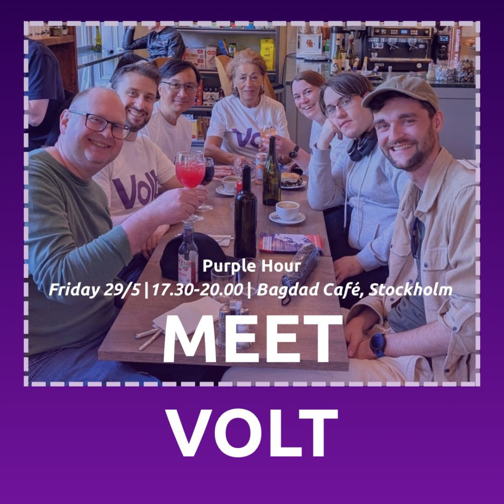 Seven people at restaurant table with text 