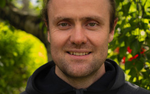 Portrait of Moritz Lang with greenery in the background