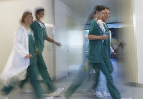 Stock photo of health staff walking in a hospital