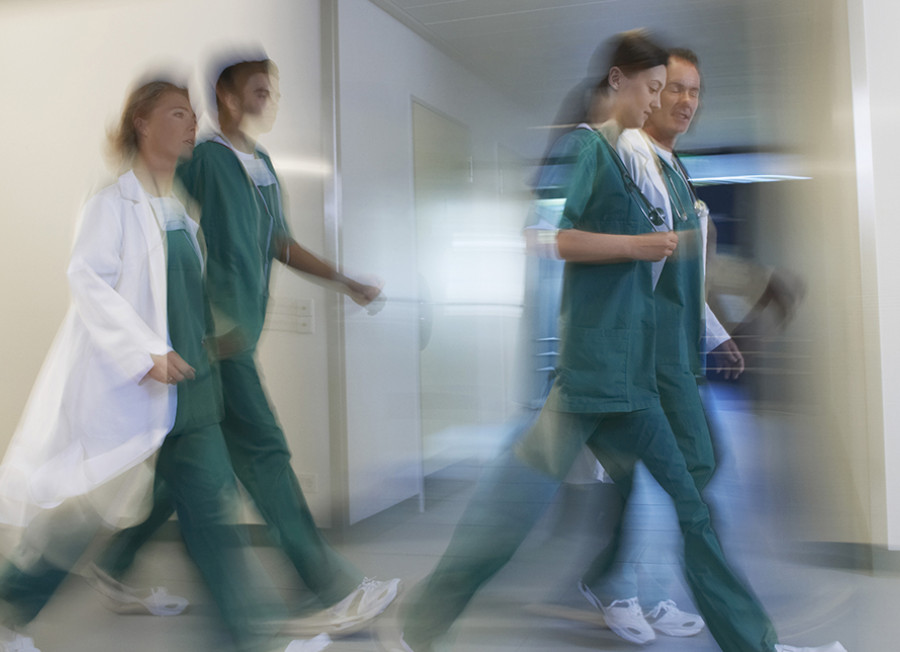 Stock photo of health staff walking in a hospital