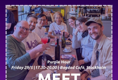 Seven people at restaurant table with text 
